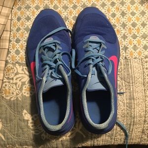 Blue woman’s Nike tennis shoes.
